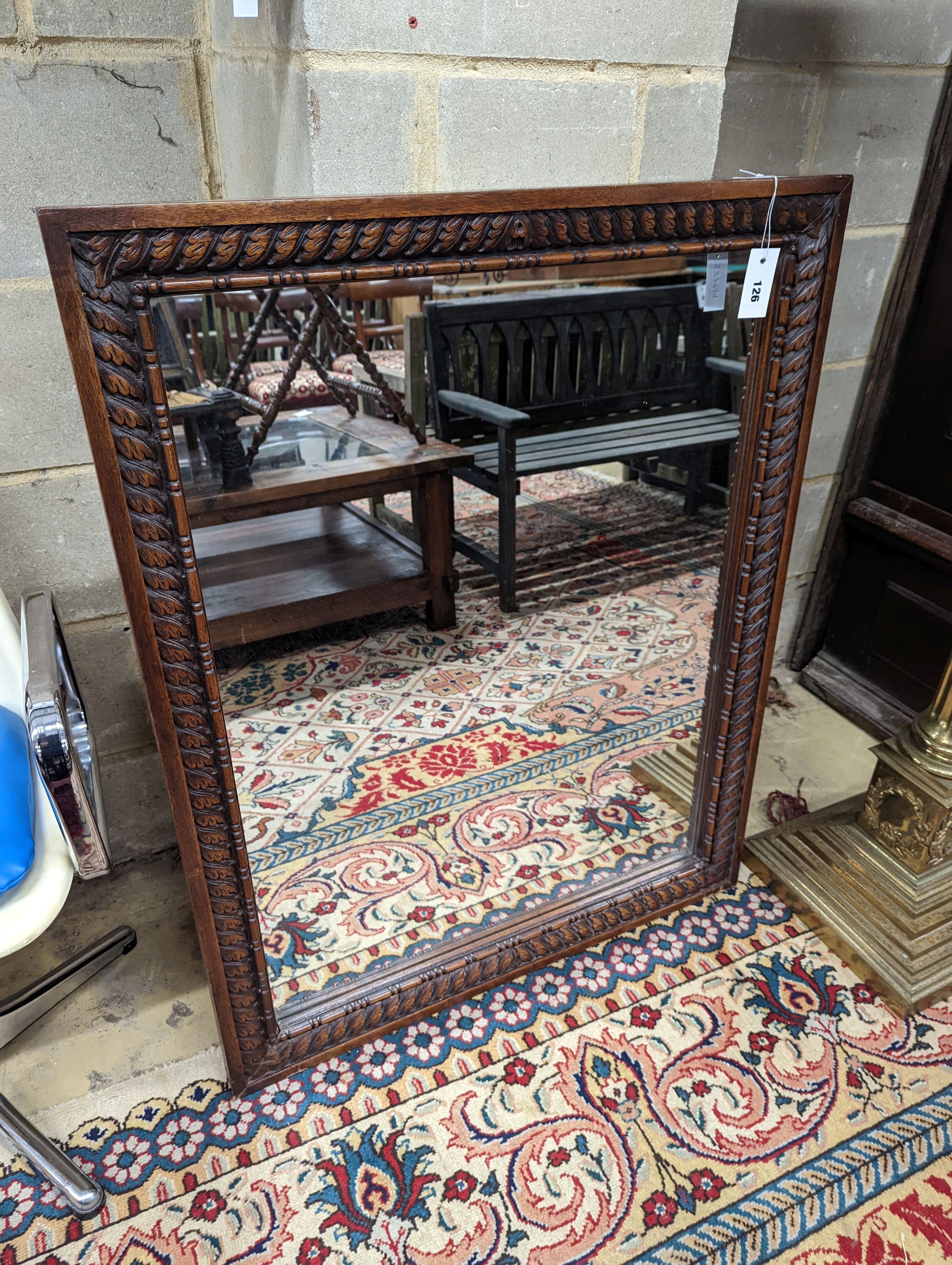 A carved mahogany rectangular wall mirror, width 82cm, height 110cm